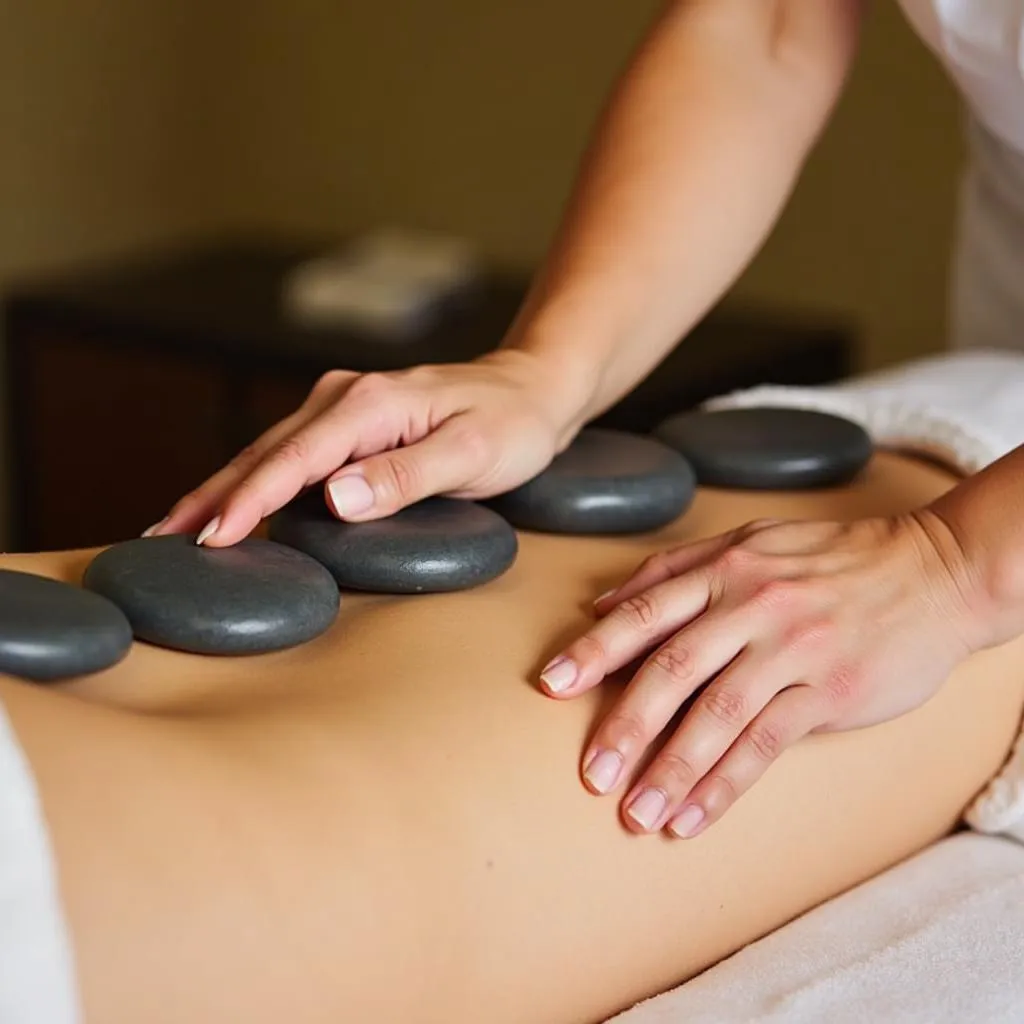 Massage Therapist Preparing Hot Stones