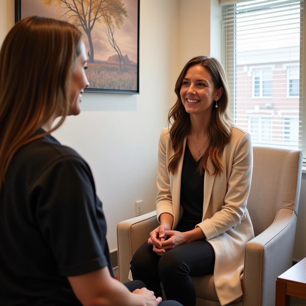 A therapist consults with a client at the 22 Havelock Road spa, discussing treatment options and personalized wellness plans.