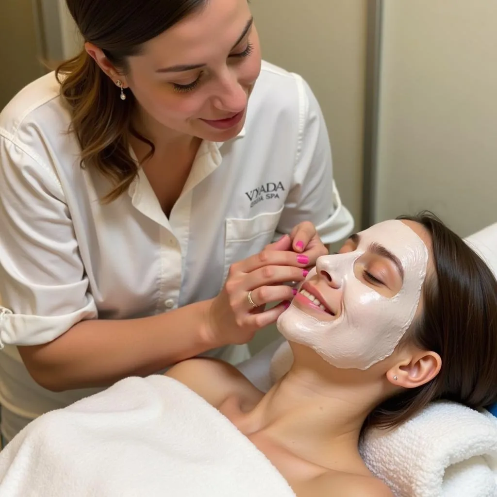 Amy applying a facial mask on a client at Viyada Spa