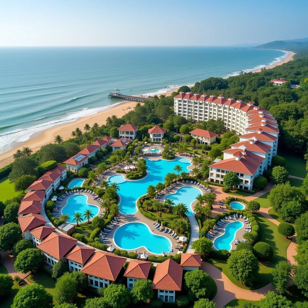 Aerial view of Taj Holiday Village Resort & Spa Goa, showcasing its lush greenery, sprawling pools, and proximity to the beach