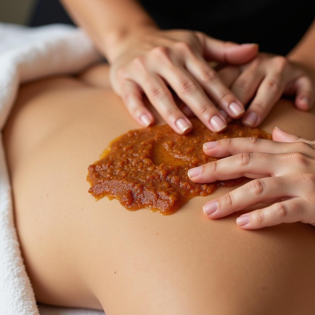 Applying Maple Body Scrub in Spa