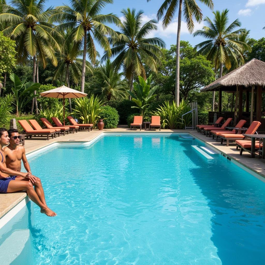 Guests relaxing by the pool at 1 Heritage Village Resort & Spa Goa