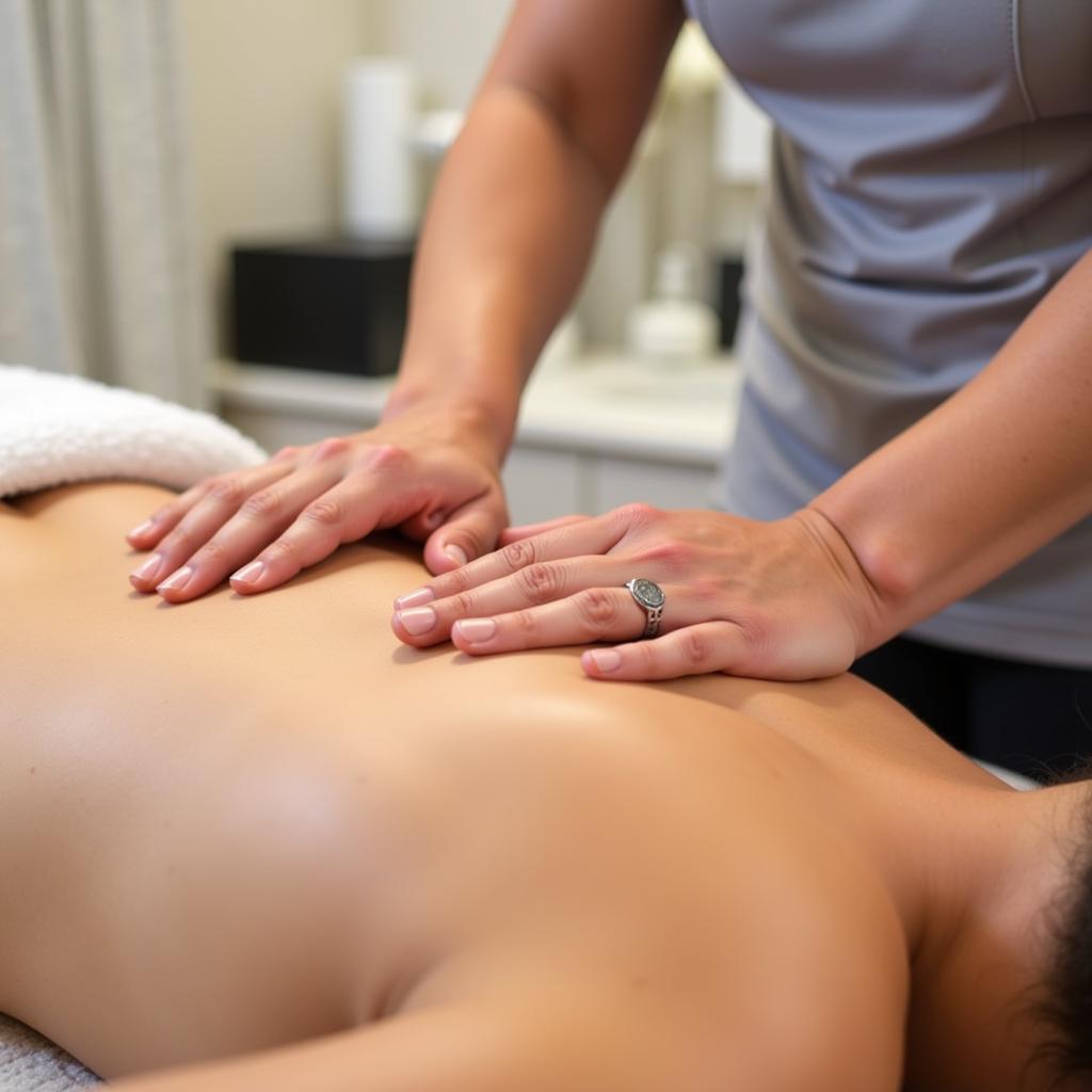 Therapist performing a massage at a tanzanite spa