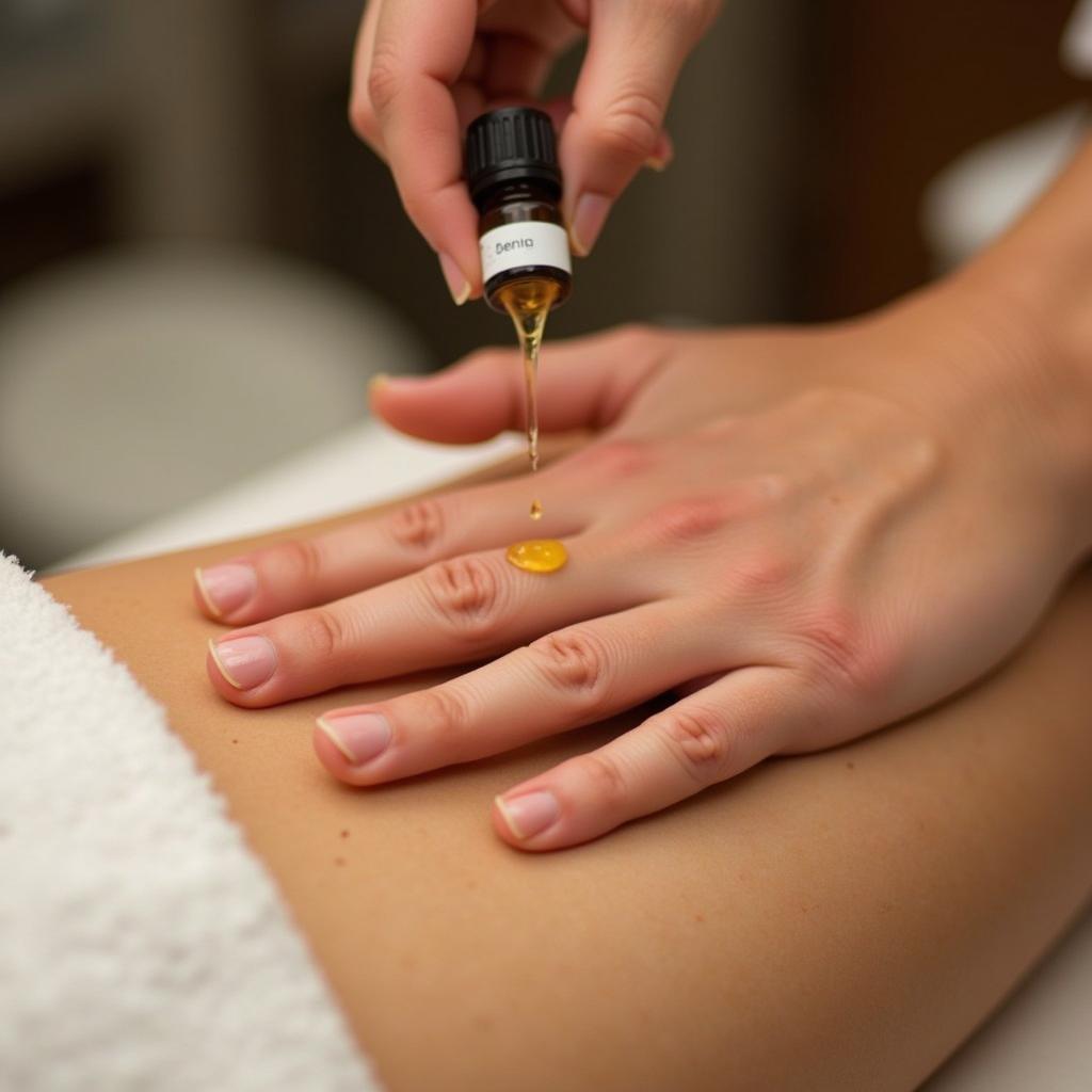 Hands receiving an aromatherapy hand spa treatment with essential oils.