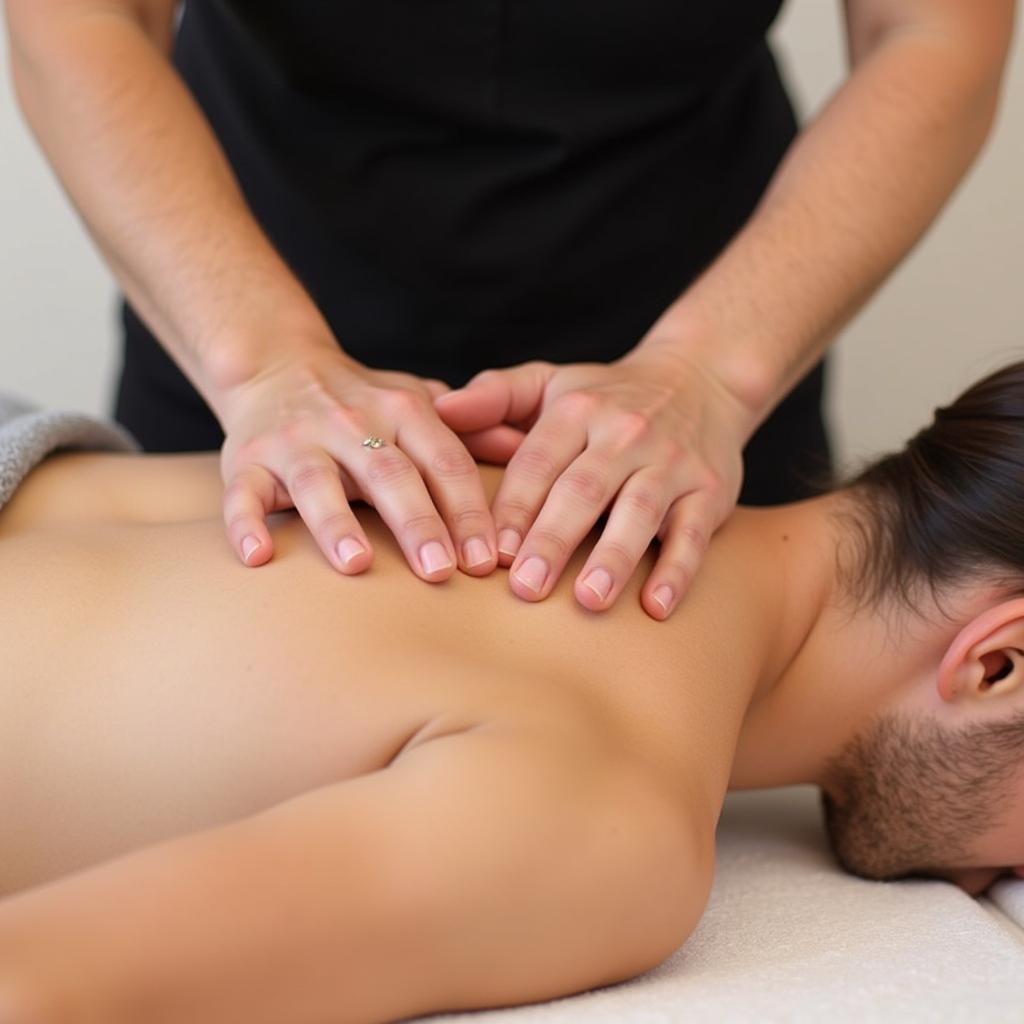 Massage therapist working on a client